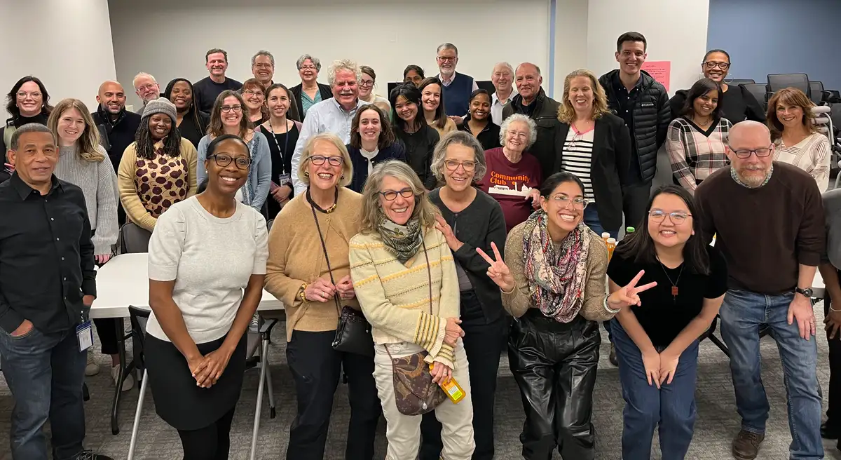 RCAN volunteers and PDS staff gathered together at a Christmas party in 2025.
